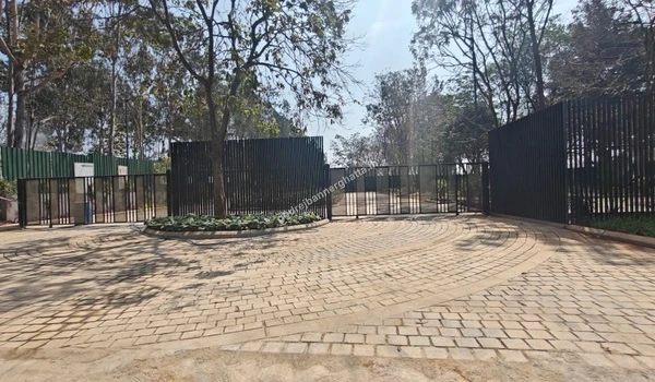 Main entrance gate structure with security cabin installed at the site