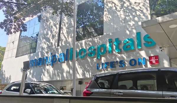 Prominent signage of Manipal Hospitals indicating top-tier medical expertise