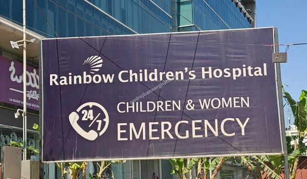 Signage of Rainbow Children's Hospital specializing in pediatric and women's care
