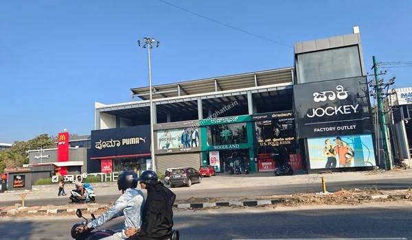 Retail outlets including Puma, Woodland, and Jockey near Godrej Bannerghatta