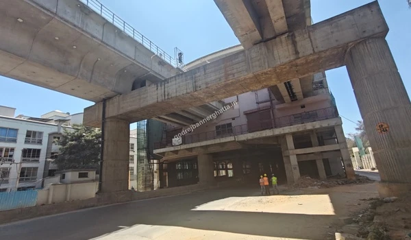 Street level view showing the massive scale of the nearby metro station development